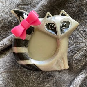 A raccoon car scent holder